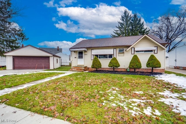 view of front of property featuring a garage and a front yard