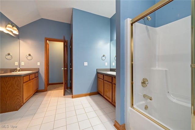 bathroom with vanity, lofted ceiling, tile patterned floors, and  shower combination