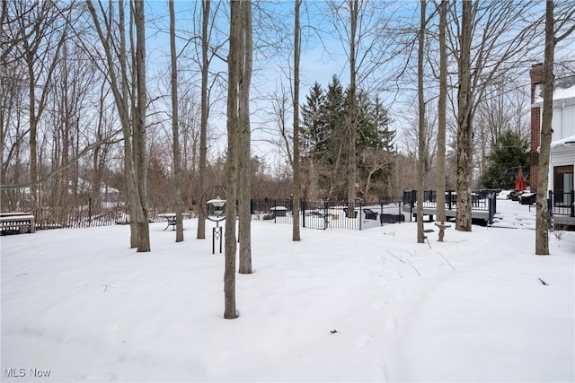 view of yard covered in snow