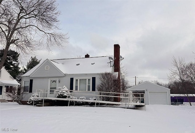 view of front facade featuring an outbuilding and a garage