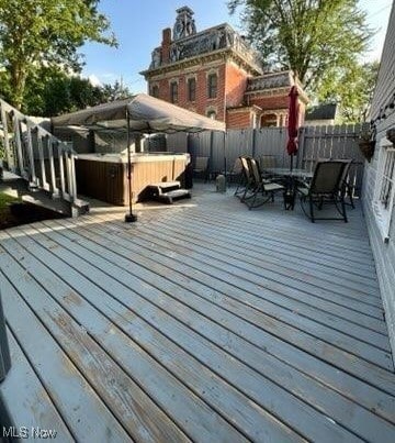 deck with a hot tub