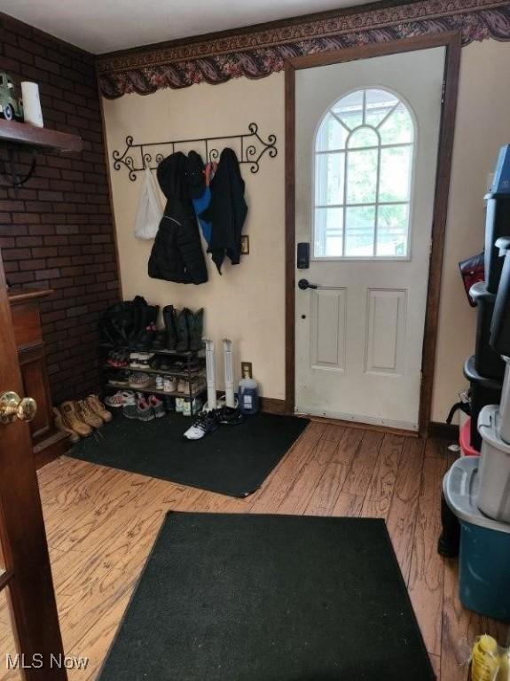 mudroom with wood-type flooring