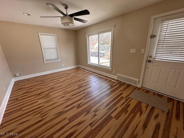 interior space featuring wood-type flooring and ceiling fan