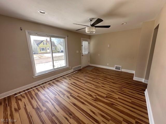 unfurnished room featuring hardwood / wood-style flooring and ceiling fan