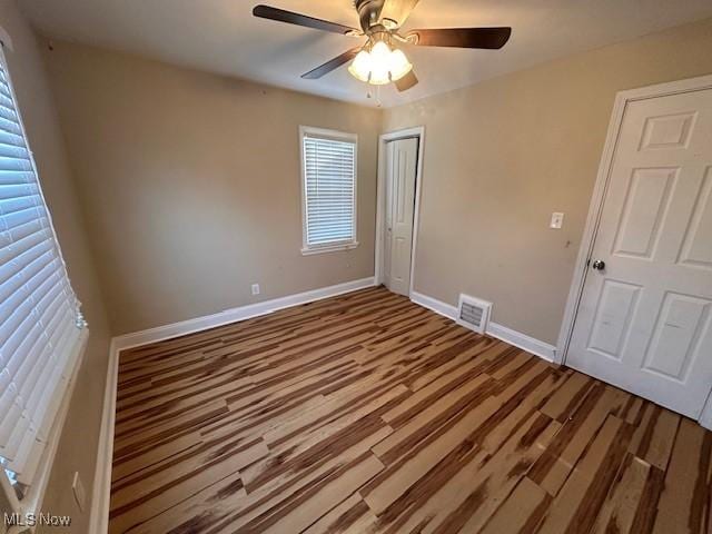 4640 W 148th St, Cleveland, OH 44135 - unfurnished bedroom featuring a ceiling fan, wood finished floors, baseboards, visible vents, and a closet