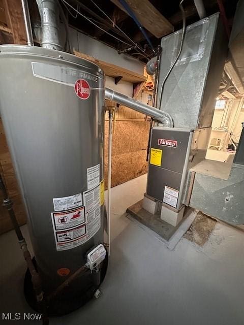 utility room featuring water heater