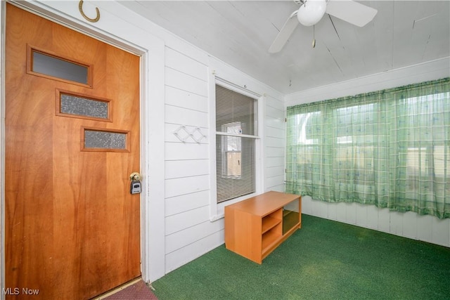 sunroom featuring ceiling fan