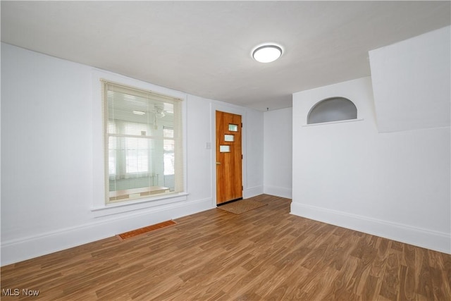 entryway with hardwood / wood-style flooring