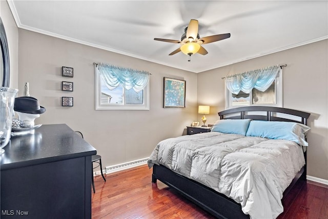 bedroom featuring crown molding, dark wood-type flooring, a baseboard radiator, and ceiling fan