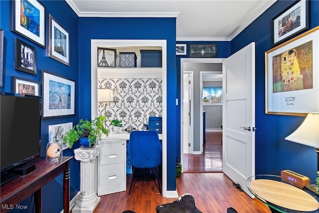 home office featuring hardwood / wood-style flooring and ornamental molding