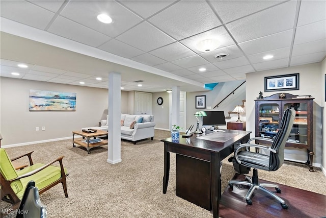 carpeted office space featuring a paneled ceiling