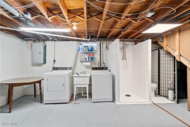 basement featuring independent washer and dryer and electric panel