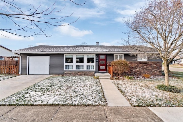 single story home featuring a garage