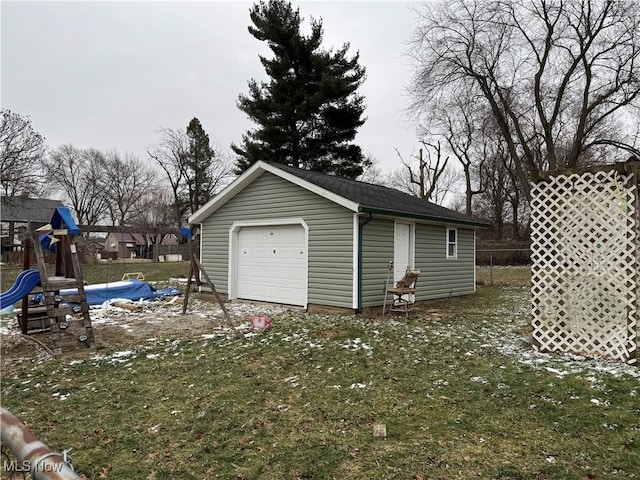 garage featuring a lawn