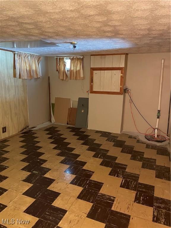 basement with a textured ceiling