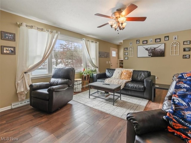 living room with hardwood / wood-style floors and ceiling fan