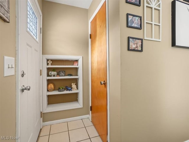 hallway featuring light tile patterned flooring