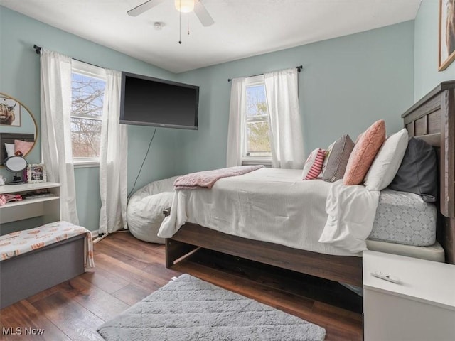 bedroom featuring dark wood-type flooring and ceiling fan