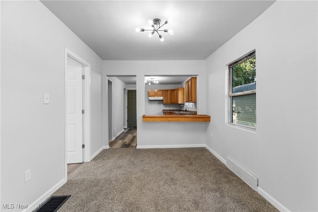 unfurnished living room with carpet flooring