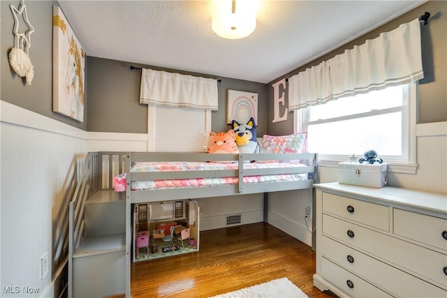 bedroom with wood-type flooring