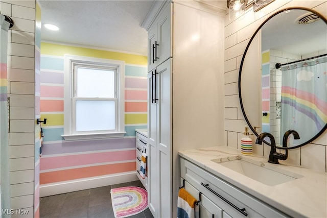 bathroom featuring tile patterned floors and vanity