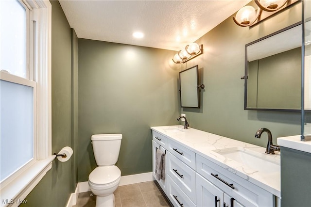 bathroom featuring tile patterned floors, toilet, and vanity