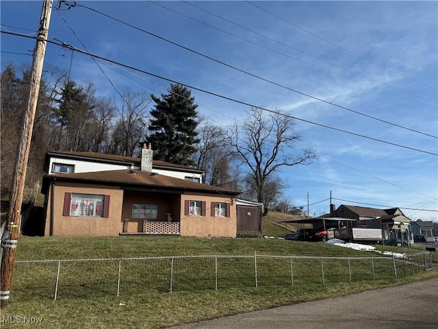 view of side of home featuring a lawn