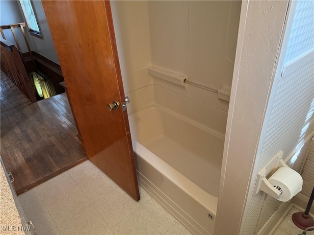 bathroom featuring a tub