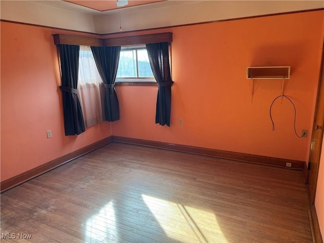 unfurnished room with light hardwood / wood-style flooring