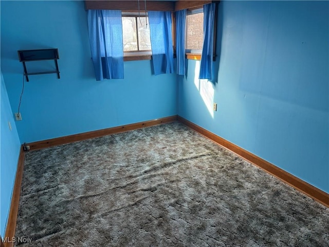 unfurnished room with carpet