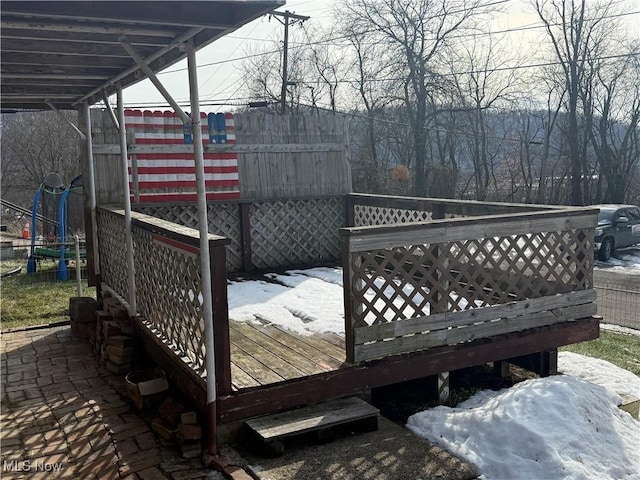 view of snow covered deck