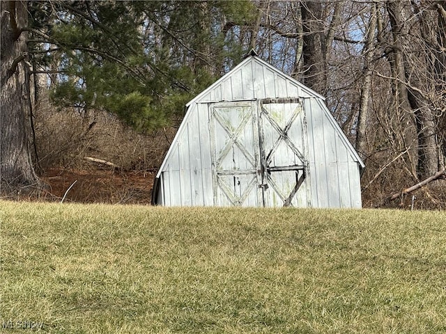 view of outbuilding with a lawn