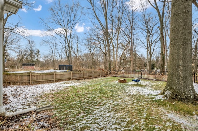 view of yard layered in snow