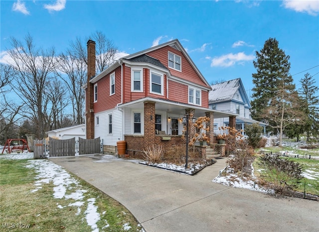 view of front property with a garage and covered porch