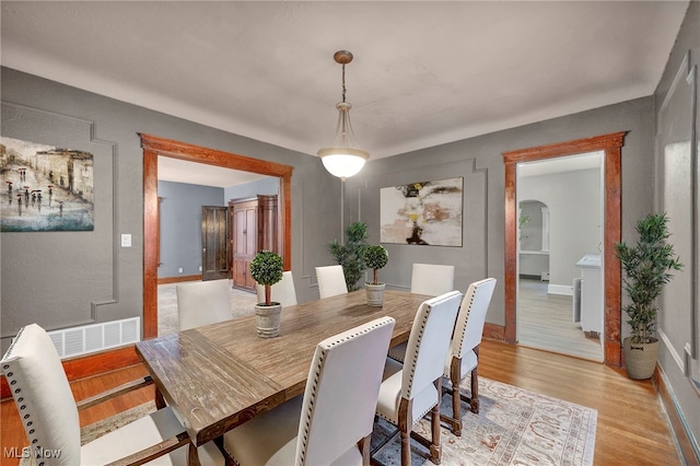 dining area with light hardwood / wood-style flooring