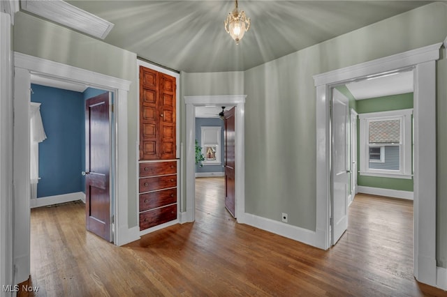 hall with wood-type flooring