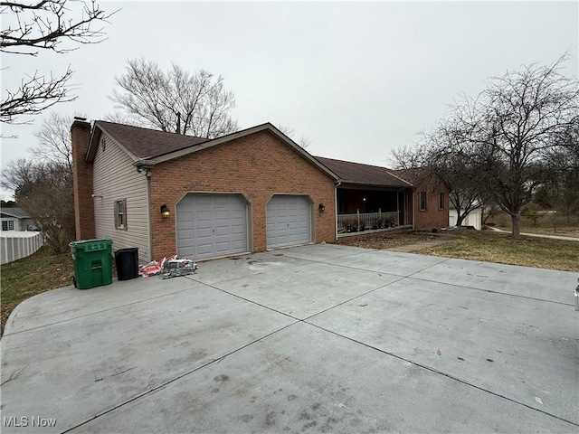 view of side of home with a garage