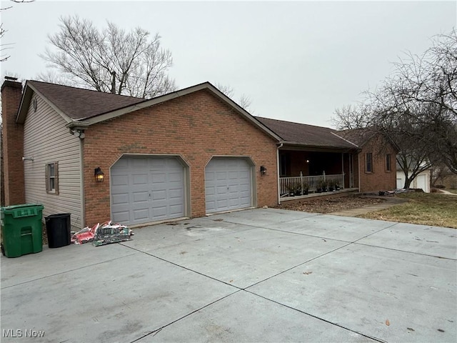 view of side of home with a garage