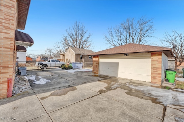 view of front of property with a garage and an outdoor structure