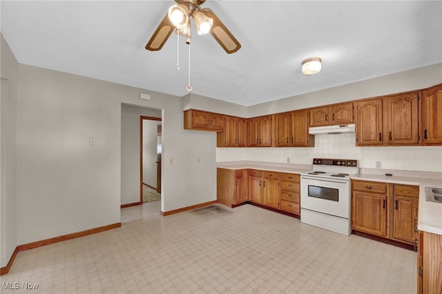 kitchen featuring ceiling fan, white range with electric cooktop, and decorative backsplash