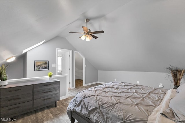 bedroom featuring ceiling fan, lofted ceiling, and hardwood / wood-style floors