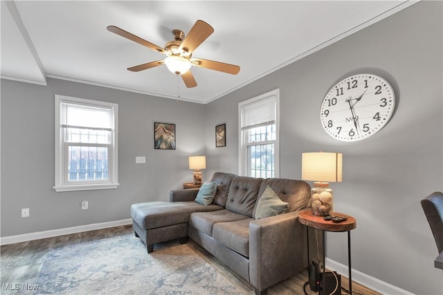 living room with crown molding, ceiling fan, and hardwood / wood-style flooring