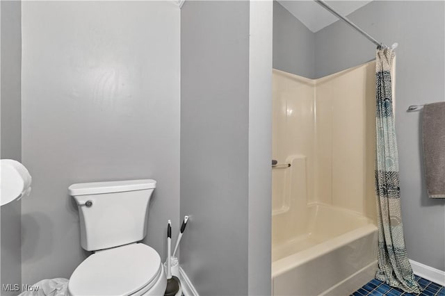 bathroom with shower / tub combo and toilet