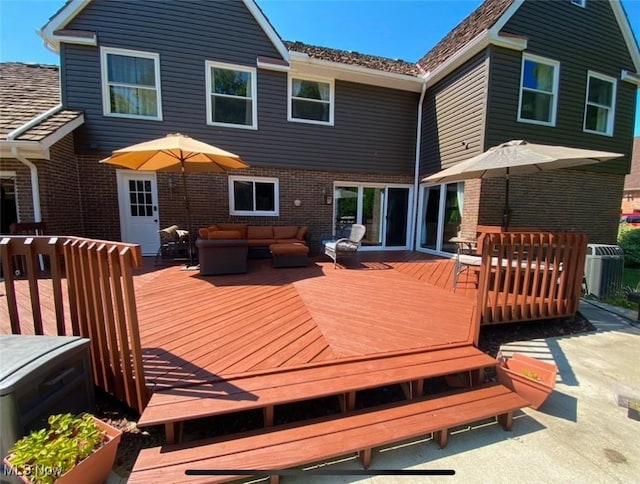 rear view of property featuring a wooden deck, an outdoor living space, and central air condition unit