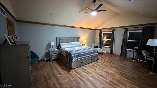 bedroom featuring crown molding, vaulted ceiling, dark hardwood / wood-style floors, and ceiling fan