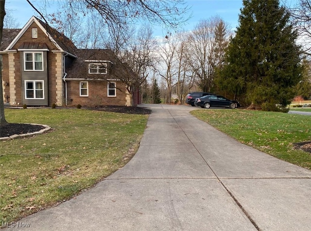 view of side of property featuring a yard