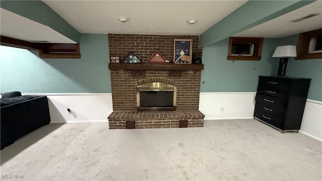 carpeted living room with a fireplace