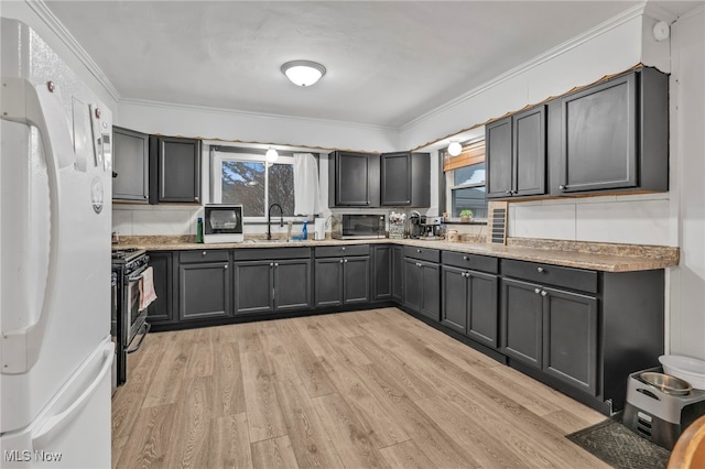 kitchen featuring crown molding, stainless steel appliances, light stone countertops, and light hardwood / wood-style floors