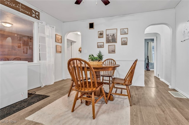 dining room featuring ceiling fan and light hardwood / wood-style flooring