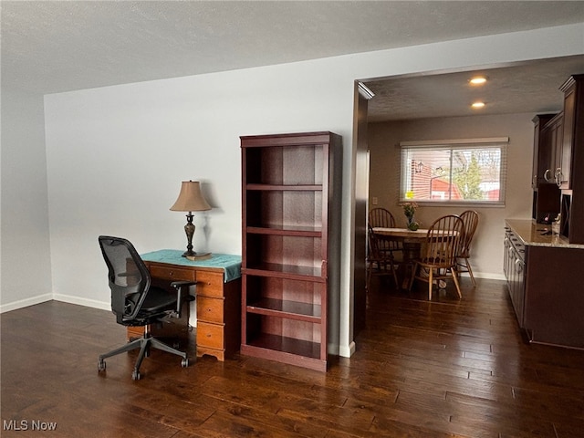 home office with dark hardwood / wood-style floors